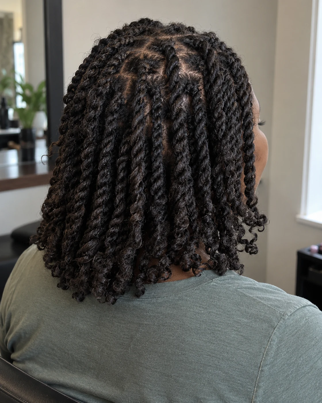 Shoulder-length two-strand twists with natural texture